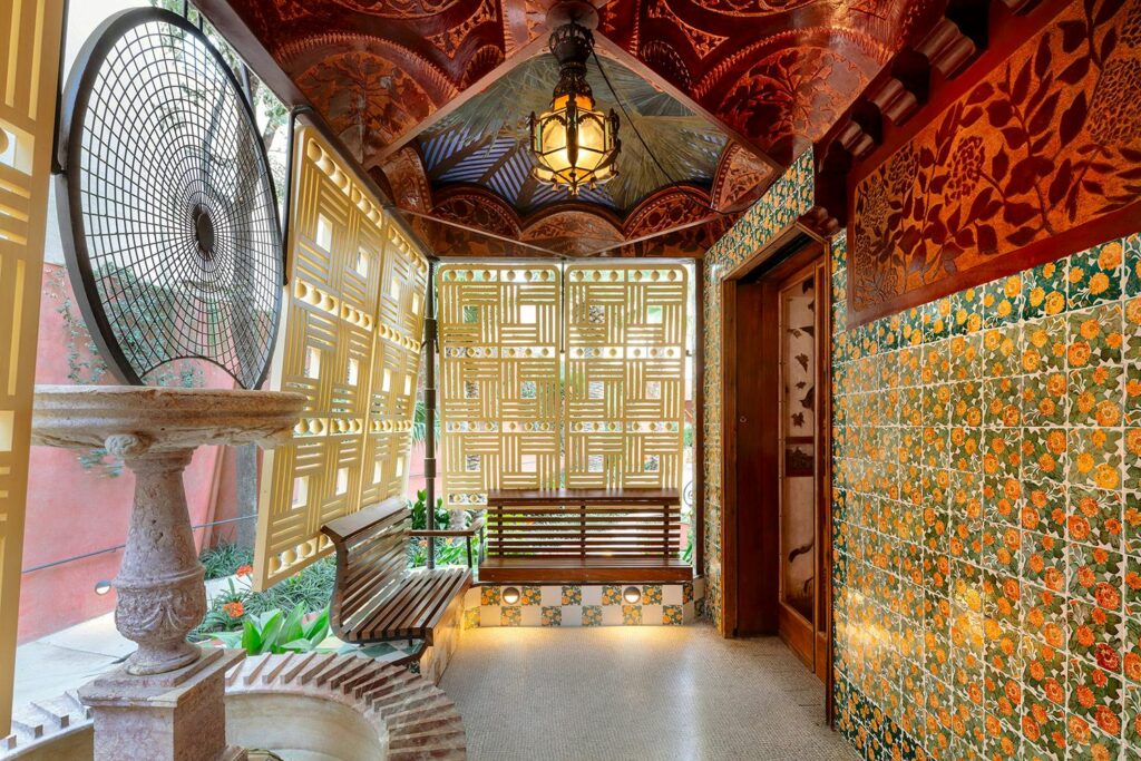 Ornate interior with benches, fountain, and decorative tiles. Passes and bundles may be available.