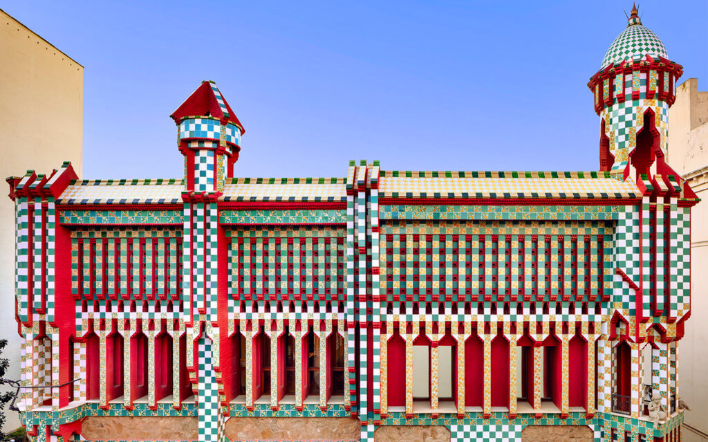 Comillas, Spain: Colorful facade of Capricho de Gaudí building with unique tile patterns and architectural details.