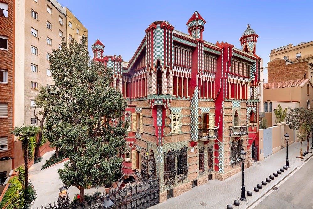 Casa Vicens, a colorful Modernist building in Barcelona with red, green, and white tile work.
